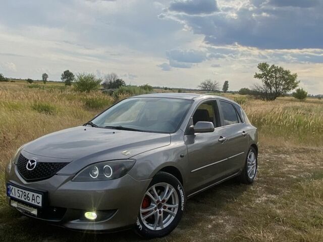 Сірий Мазда 3, об'ємом двигуна 1.6 л та пробігом 293 тис. км за 3613 $, фото 3 на Automoto.ua