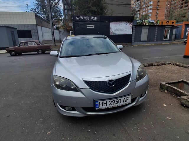 Сірий Мазда 3, об'ємом двигуна 2 л та пробігом 221 тис. км за 3491 $, фото 4 на Automoto.ua