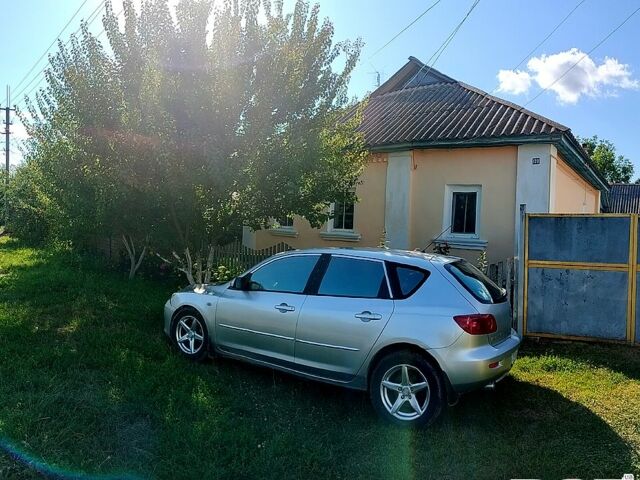 Серый Мазда 3, объемом двигателя 2 л и пробегом 302 тыс. км за 4500 $, фото 1 на Automoto.ua
