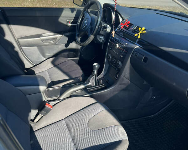 Серый Мазда 3, объемом двигателя 1.56 л и пробегом 170 тыс. км за 2450 $, фото 7 на Automoto.ua