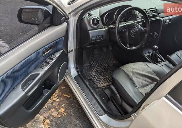 Серый Мазда 3, объемом двигателя 2 л и пробегом 145 тыс. км за 3999 $, фото 18 на Automoto.ua