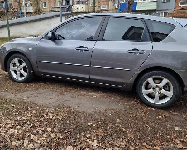 Сірий Мазда 3, об'ємом двигуна 2 л та пробігом 203 тис. км за 4200 $, фото 2 на Automoto.ua