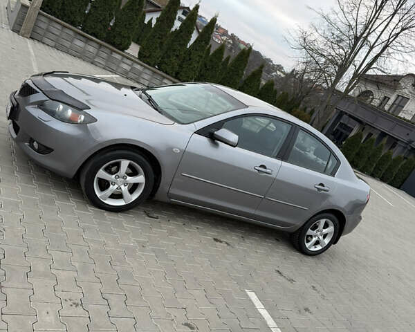 Серый Мазда 3, объемом двигателя 1.6 л и пробегом 222 тыс. км за 3599 $, фото 1 на Automoto.ua