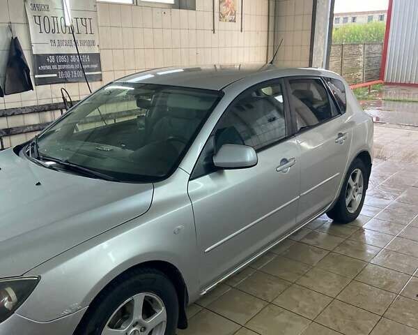 Серый Мазда 3, объемом двигателя 1.3 л и пробегом 189 тыс. км за 3700 $, фото 1 на Automoto.ua