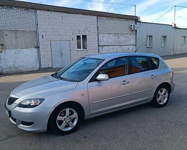 Серый Мазда 3, объемом двигателя 1.6 л и пробегом 215 тыс. км за 3999 $, фото 1 на Automoto.ua