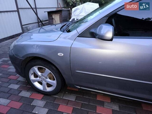Серый Мазда 3, объемом двигателя 1.6 л и пробегом 180 тыс. км за 4500 $, фото 1 на Automoto.ua