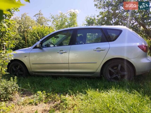 Сірий Мазда 3, об'ємом двигуна 1.4 л та пробігом 214 тис. км за 4299 $, фото 4 на Automoto.ua