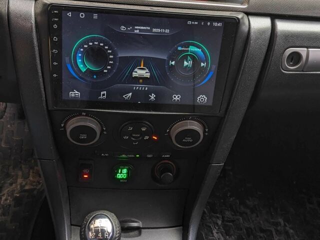 Сірий Мазда 3, об'ємом двигуна 2 л та пробігом 145 тис. км за 3999 $, фото 2 на Automoto.ua