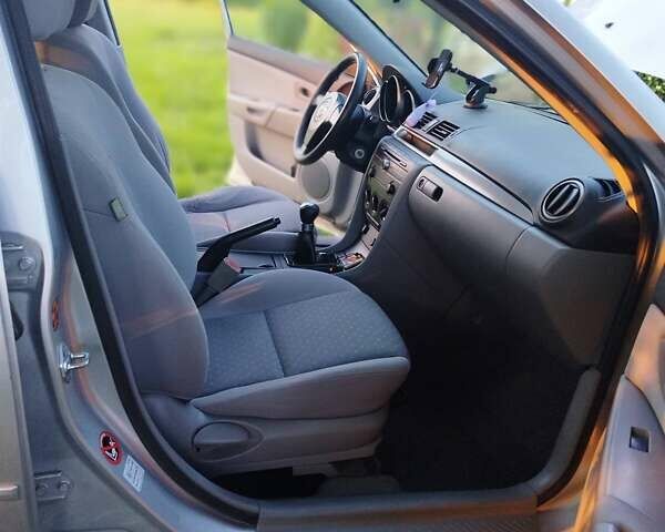 Сірий Мазда 3, об'ємом двигуна 1.4 л та пробігом 214 тис. км за 4299 $, фото 13 на Automoto.ua