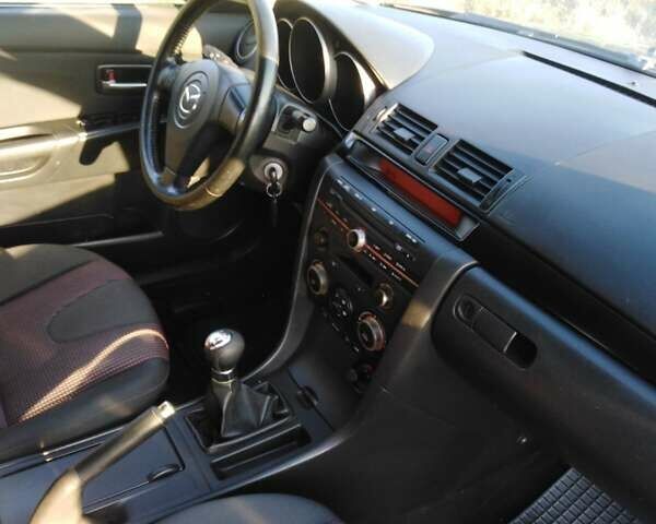 Серый Мазда 3, объемом двигателя 1.56 л и пробегом 170 тыс. км за 5100 $, фото 7 на Automoto.ua