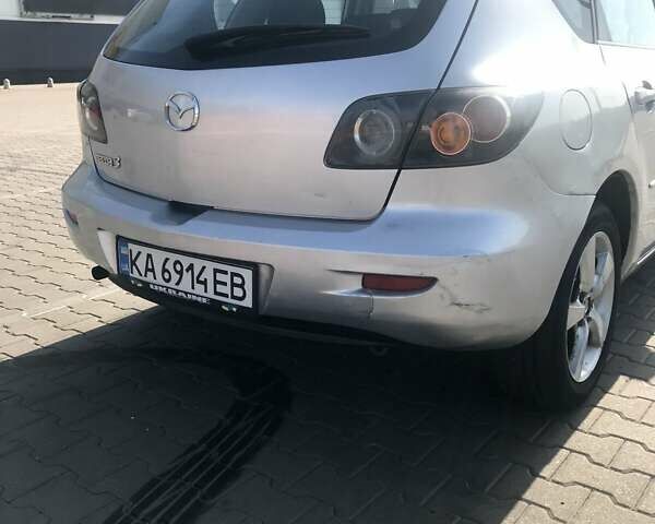 Серый Мазда 3, объемом двигателя 1.3 л и пробегом 235 тыс. км за 3400 $, фото 2 на Automoto.ua