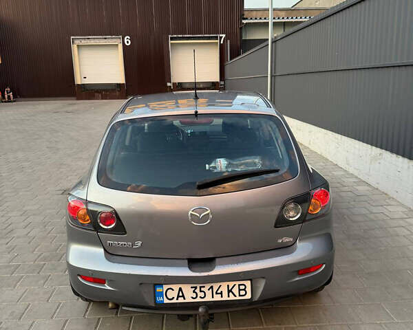 Серый Мазда 3, объемом двигателя 1.6 л и пробегом 230 тыс. км за 4000 $, фото 3 на Automoto.ua