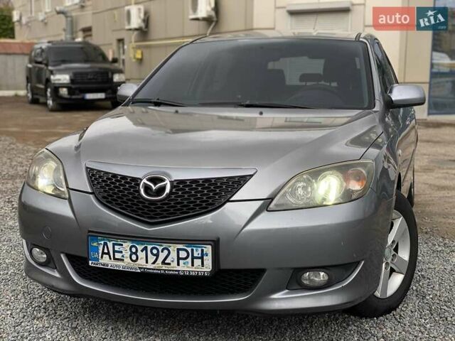 Серый Мазда 3, объемом двигателя 1.6 л и пробегом 200 тыс. км за 4850 $, фото 1 на Automoto.ua