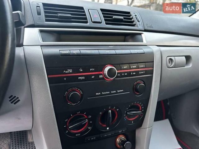 Сірий Мазда 3, об'ємом двигуна 1.4 л та пробігом 198 тис. км за 5490 $, фото 20 на Automoto.ua