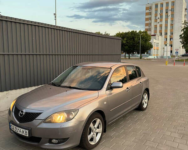 Серый Мазда 3, объемом двигателя 1.6 л и пробегом 230 тыс. км за 4000 $, фото 1 на Automoto.ua