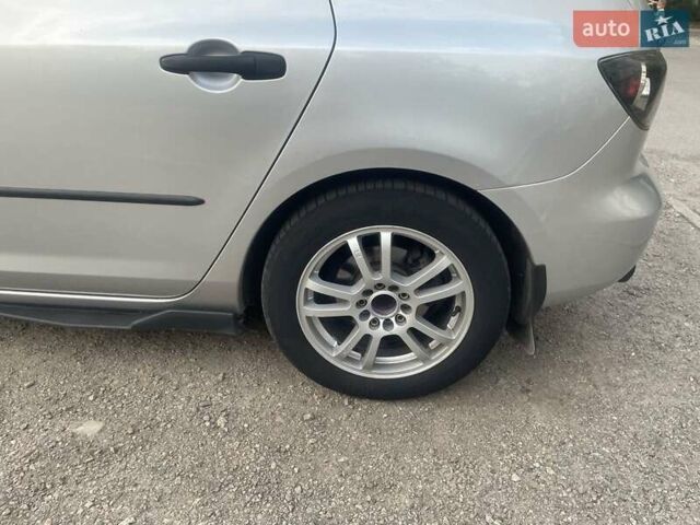 Серый Мазда 3, объемом двигателя 1.3 л и пробегом 221 тыс. км за 4999 $, фото 1 на Automoto.ua