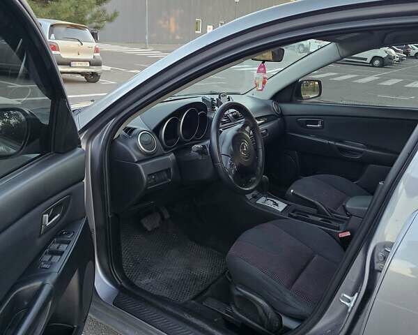 Серый Мазда 3, объемом двигателя 1.6 л и пробегом 235 тыс. км за 4999 $, фото 1 на Automoto.ua
