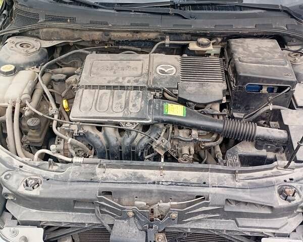 Серый Мазда 3, объемом двигателя 1.3 л и пробегом 228 тыс. км за 2800 $, фото 6 на Automoto.ua