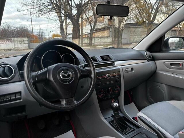 Серый Мазда 3, объемом двигателя 1.4 л и пробегом 198 тыс. км за 5490 $, фото 15 на Automoto.ua