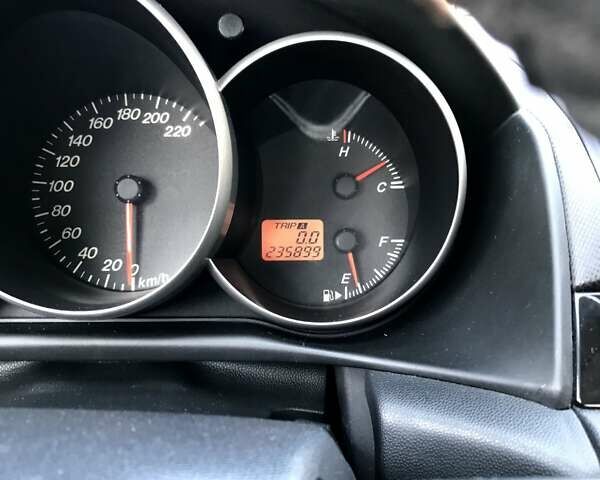 Серый Мазда 3, объемом двигателя 1.3 л и пробегом 235 тыс. км за 3400 $, фото 9 на Automoto.ua