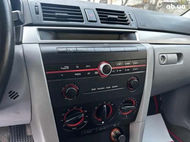 Сірий Мазда 3, об'ємом двигуна 1.4 л та пробігом 198 тис. км за 5490 $, фото 20 на Automoto.ua