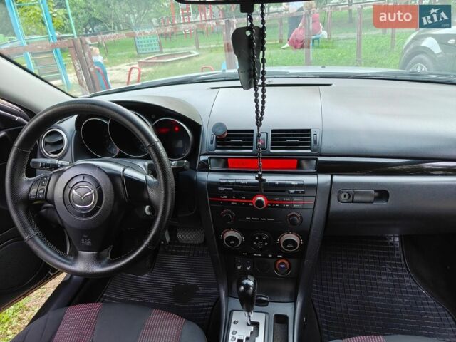 Серый Мазда 3, объемом двигателя 1.6 л и пробегом 270 тыс. км за 4100 $, фото 12 на Automoto.ua