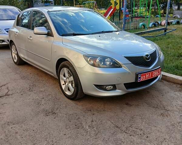 Сірий Мазда 3, об'ємом двигуна 1.6 л та пробігом 181 тис. км за 4650 $, фото 17 на Automoto.ua