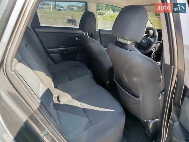 Сірий Мазда 3, об'ємом двигуна 1.6 л та пробігом 297 тис. км за 5550 $, фото 9 на Automoto.ua