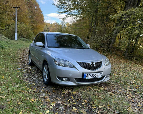Серый Мазда 3, объемом двигателя 1.6 л и пробегом 248 тыс. км за 4800 $, фото 1 на Automoto.ua