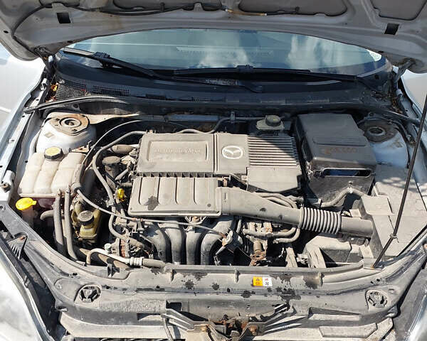 Серый Мазда 3, объемом двигателя 1.6 л и пробегом 211 тыс. км за 4750 $, фото 15 на Automoto.ua