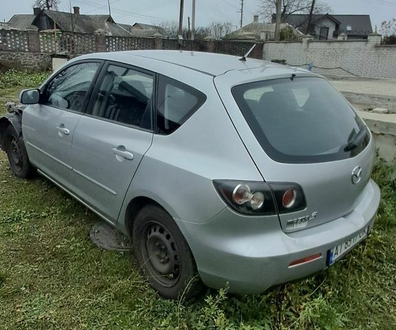 Серый Мазда 3, объемом двигателя 1.6 л и пробегом 370 тыс. км за 2200 $, фото 1 на Automoto.ua