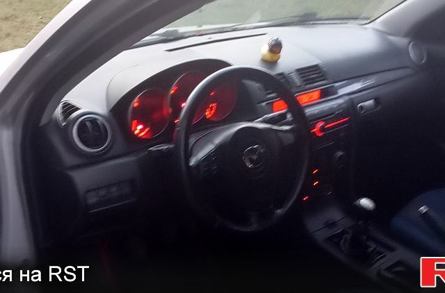 Серый Мазда 3, объемом двигателя 2 л и пробегом 230 тыс. км за 3100 $, фото 3 на Automoto.ua