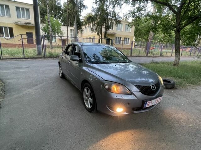 Серый Мазда 3, объемом двигателя 1.6 л и пробегом 250 тыс. км за 1950 $, фото 1 на Automoto.ua