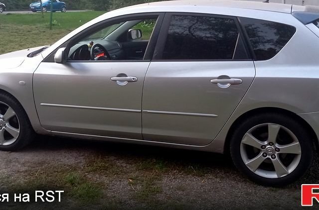 Серый Мазда 3, объемом двигателя 2 л и пробегом 230 тыс. км за 3100 $, фото 2 на Automoto.ua