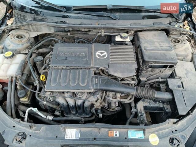 Серый Мазда 3, объемом двигателя 1.6 л и пробегом 297 тыс. км за 4600 $, фото 1 на Automoto.ua