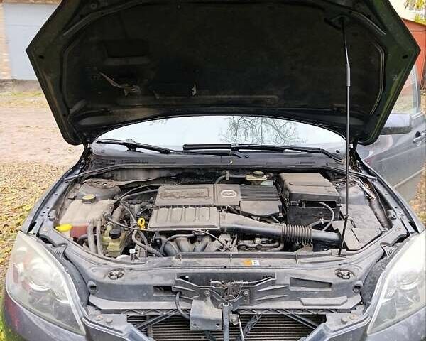 Серый Мазда 3, объемом двигателя 1.6 л и пробегом 290 тыс. км за 4500 $, фото 1 на Automoto.ua