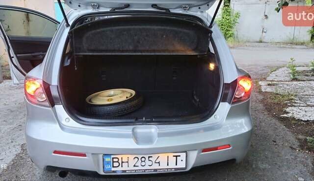 Серый Мазда 3, объемом двигателя 1.6 л и пробегом 297 тыс. км за 5600 $, фото 13 на Automoto.ua