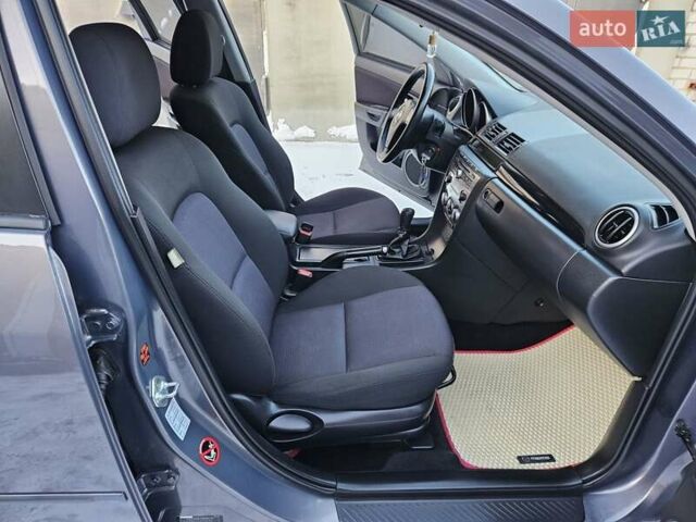 Сірий Мазда 3, об'ємом двигуна 1.6 л та пробігом 289 тис. км за 5300 $, фото 78 на Automoto.ua