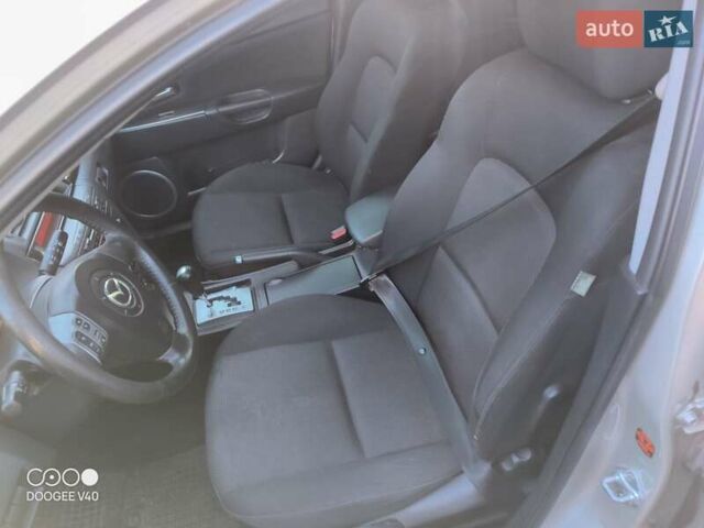 Серый Мазда 3, объемом двигателя 1.6 л и пробегом 185 тыс. км за 5999 $, фото 10 на Automoto.ua