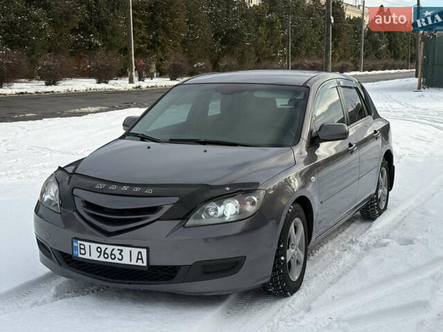 Серый Мазда 3, объемом двигателя 1.6 л и пробегом 200 тыс. км за 5999 $, фото 2 на Automoto.ua
