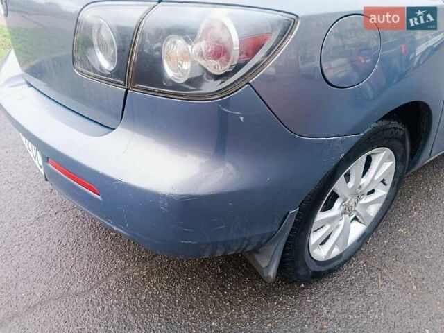 Серый Мазда 3, объемом двигателя 1.56 л и пробегом 269 тыс. км за 5200 $, фото 25 на Automoto.ua