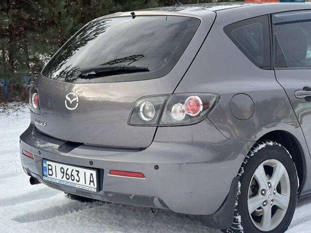 Сірий Мазда 3, об'ємом двигуна 1.6 л та пробігом 220 тис. км за 5777 $, фото 16 на Automoto.ua