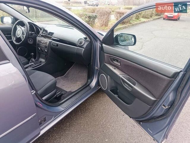 Серый Мазда 3, объемом двигателя 1.56 л и пробегом 269 тыс. км за 5200 $, фото 12 на Automoto.ua