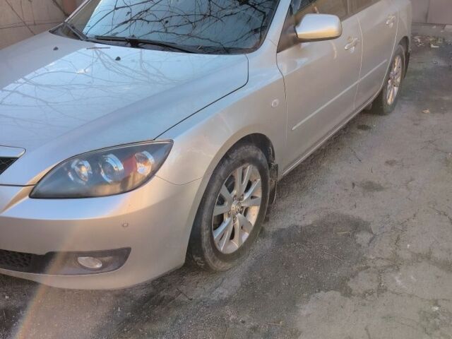 Серый Мазда 3, объемом двигателя 1.6 л и пробегом 185 тыс. км за 4200 $, фото 1 на Automoto.ua