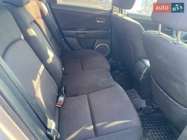 Серый Мазда 3, объемом двигателя 2 л и пробегом 301 тыс. км за 5400 $, фото 11 на Automoto.ua