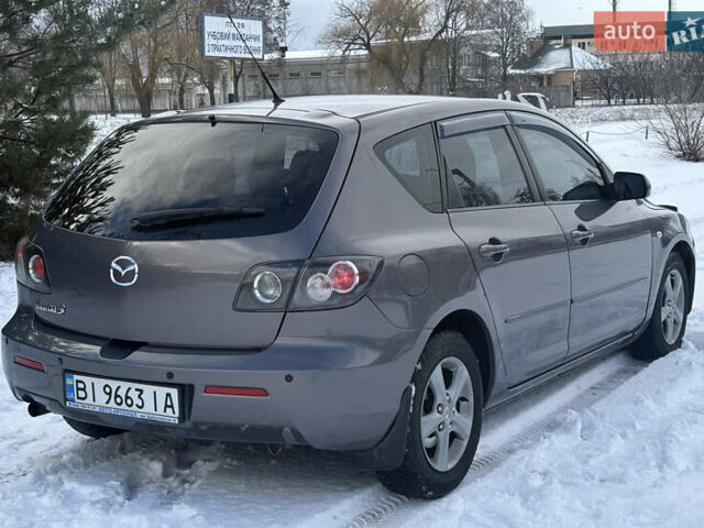 Серый Мазда 3, объемом двигателя 1.6 л и пробегом 200 тыс. км за 5999 $, фото 25 на Automoto.ua