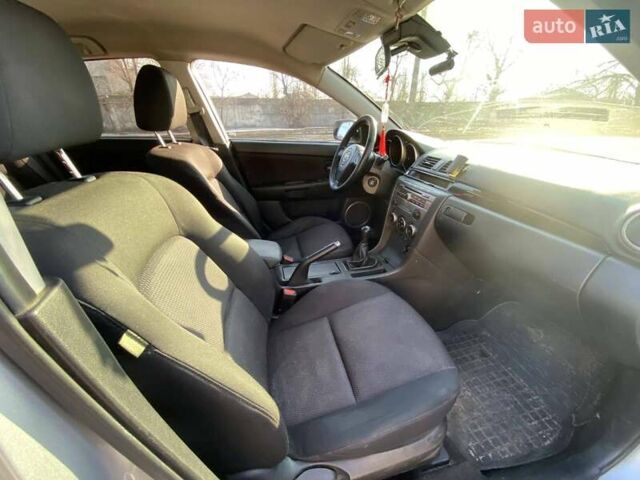 Серый Мазда 3, объемом двигателя 2 л и пробегом 301 тыс. км за 5400 $, фото 13 на Automoto.ua
