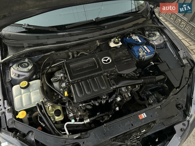 Серый Мазда 3, объемом двигателя 1.6 л и пробегом 66 тыс. км за 6999 $, фото 14 на Automoto.ua
