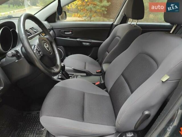 Серый Мазда 3, объемом двигателя 1.6 л и пробегом 191 тыс. км за 5500 $, фото 17 на Automoto.ua
