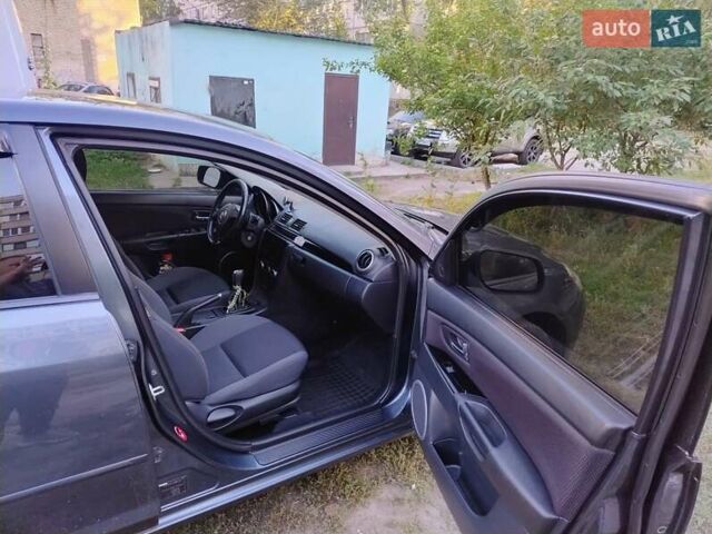 Серый Мазда 3, объемом двигателя 1.6 л и пробегом 193 тыс. км за 6000 $, фото 1 на Automoto.ua
